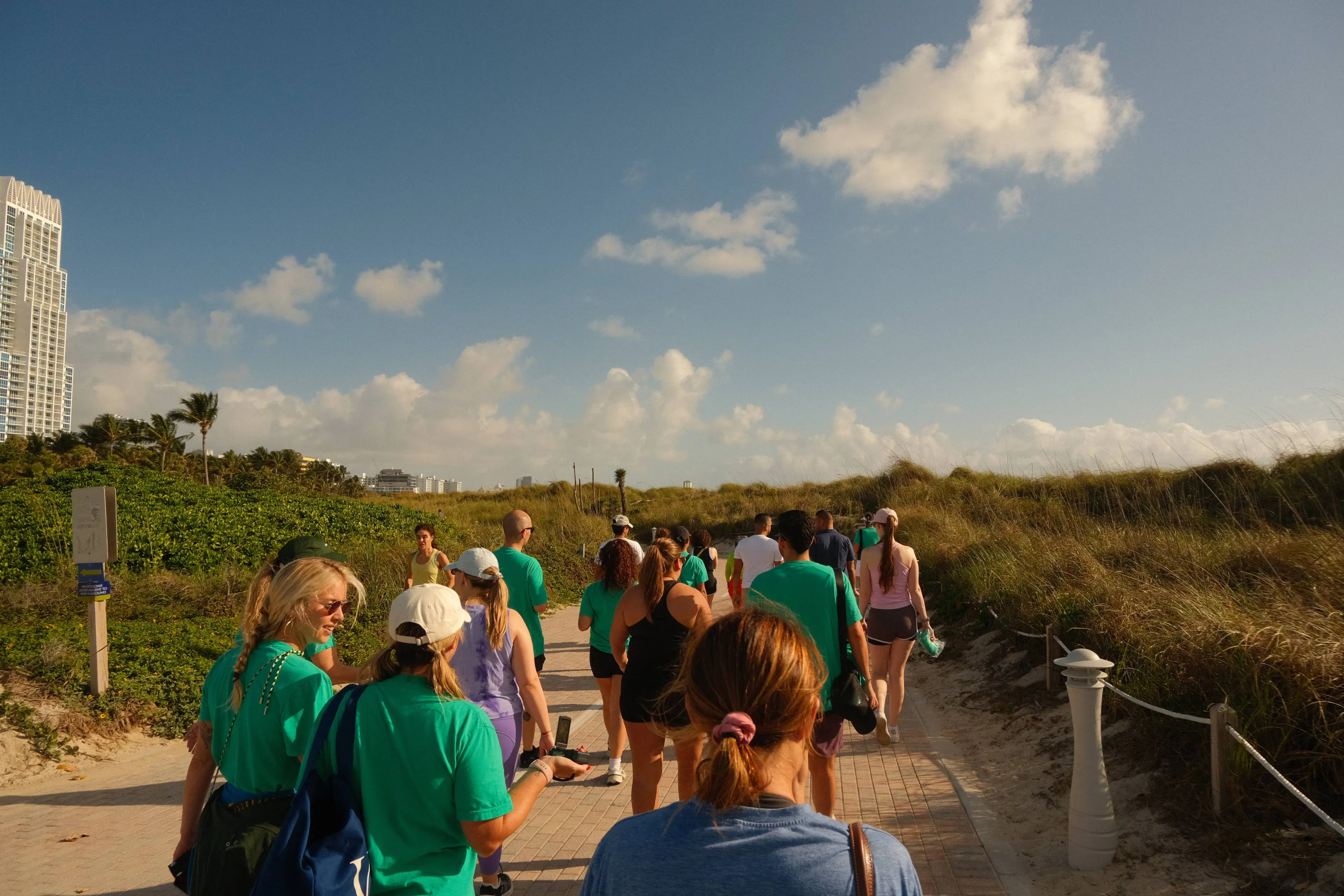 Hikers on a ridge path at golden hour